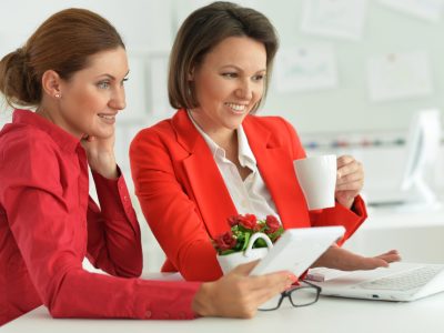 young beautiful and emotional businesswomen working in modern office